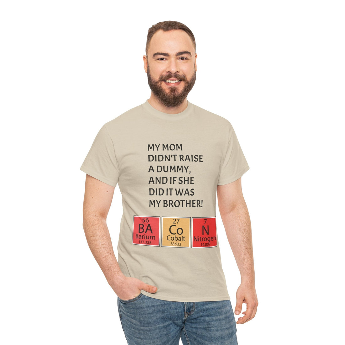 Funny brother gift t-shirt reading ‘My Mom Didn’t Raise a Dummy, And If She Did It Was My Brother’ with periodic table BACON design, modeled by a man.