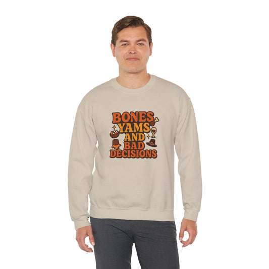Man wearing a beige Thanksgiving sweatshirt with the phrase ‘Bones, Yams, and Bad Decisions’ in bold orange lettering surrounded by food icons.