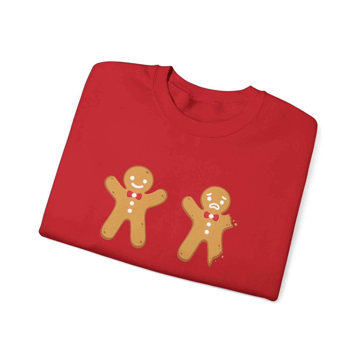 A folded red shirt with 2 gingerbread men on the front