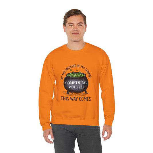 Something Wicked This Way Comes Halloween sweatshirt featuring a witch's cauldron graphic, perfect for spooky season, Halloween parties, pumpkin patches, and gothic fall fashion.