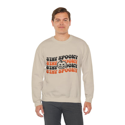 Model wearing the Stay Spooky Retro Halloween Sweatshirt featuring a vintage 70s-inspired spooky season graphic.